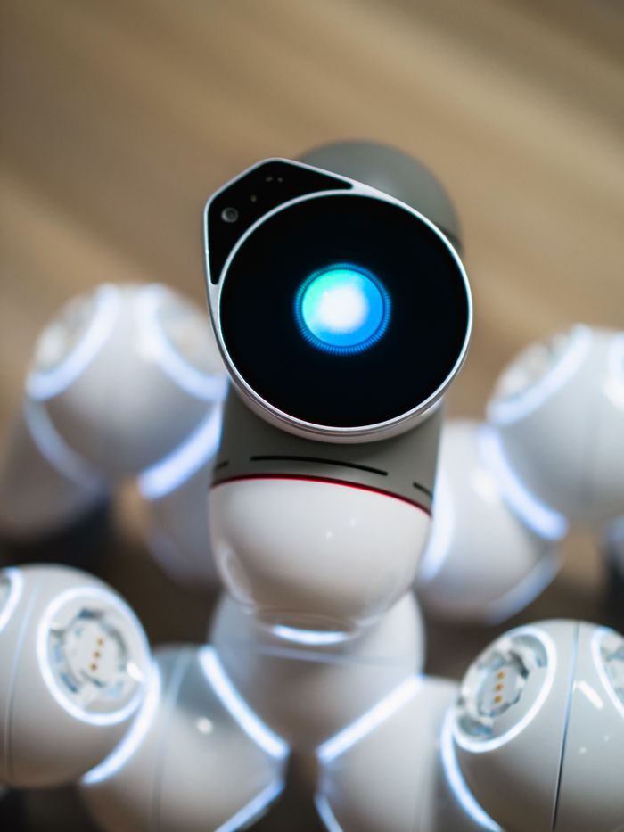 Services Close-up view of a humanoid robot with a glowing blue eye, symbolizing advanced technology.